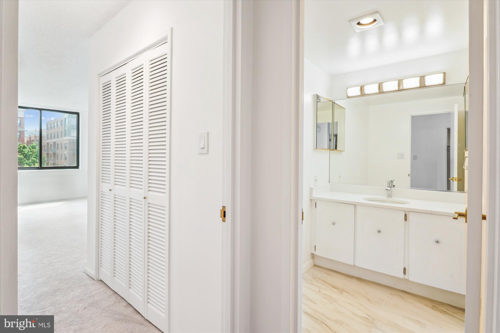 2555 Pennsylvania Avenue Northwest, Unit 816 Washington, DC 20037 - Photo 20 of 54 a bathroom with a sink a mirror and a window