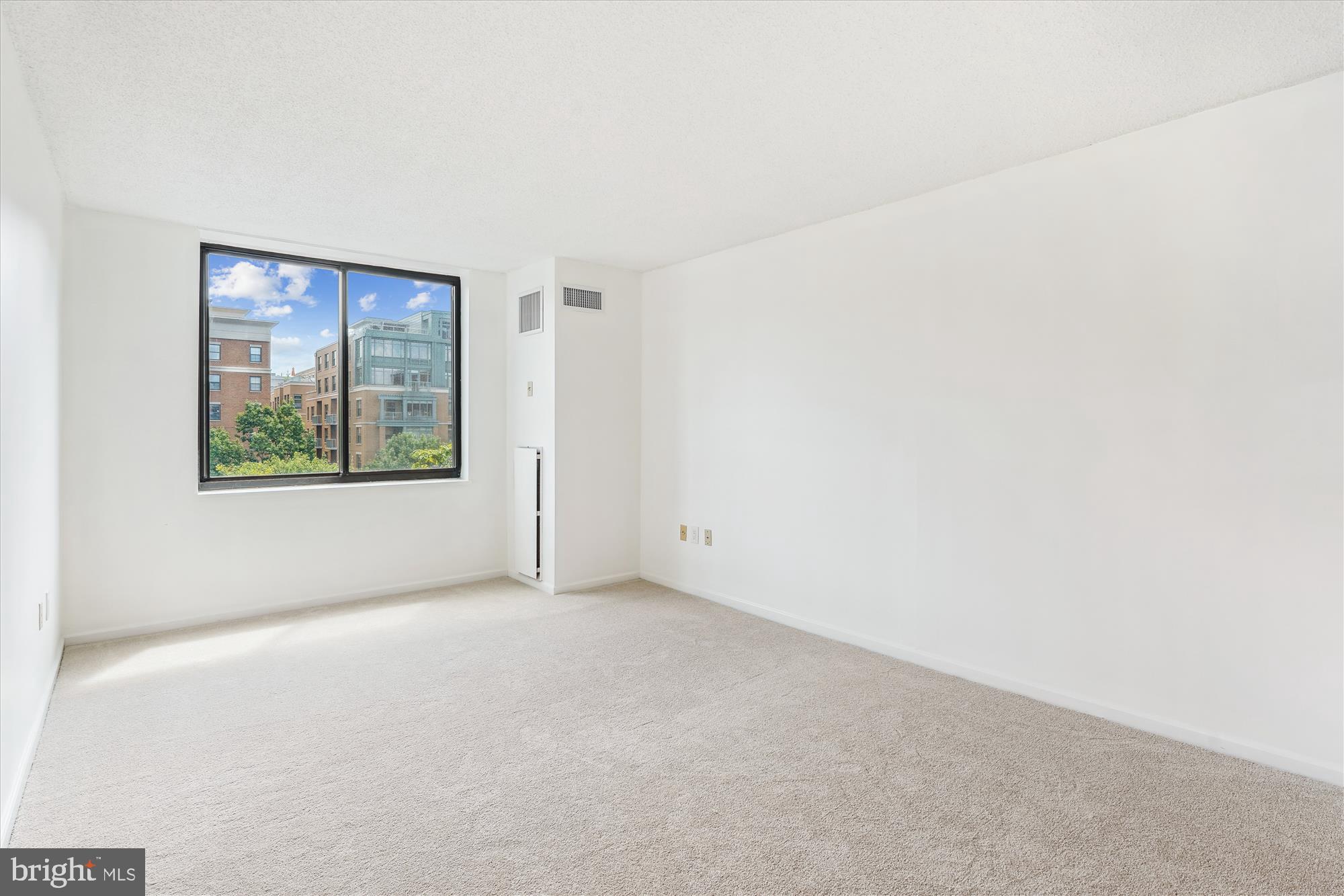 2555 Pennsylvania Avenue Northwest, Unit 816 Washington, DC 20037 - Photo 26 of 54 an empty room with windows