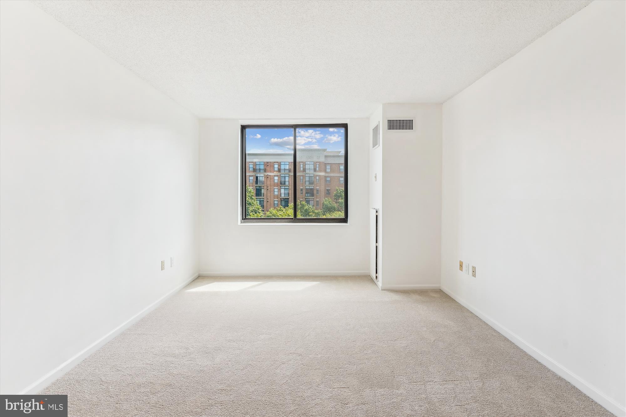 2555 Pennsylvania Avenue Northwest, Unit 816 Washington, DC 20037 - Photo 30 of 54 an empty room with windows