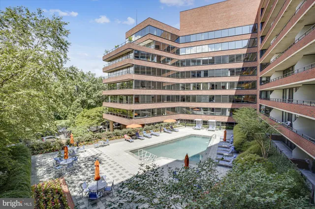 a hallway with dining table and wooden floor