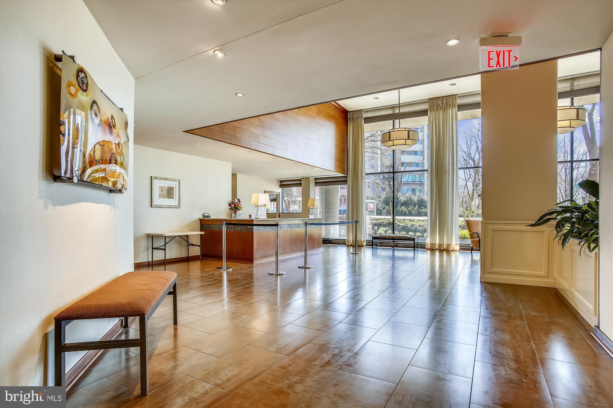 2555 Pennsylvania Avenue Northwest, Unit 816 Washington, DC 20037 - Photo 41 of 54 a hallway with dining table and wooden floor