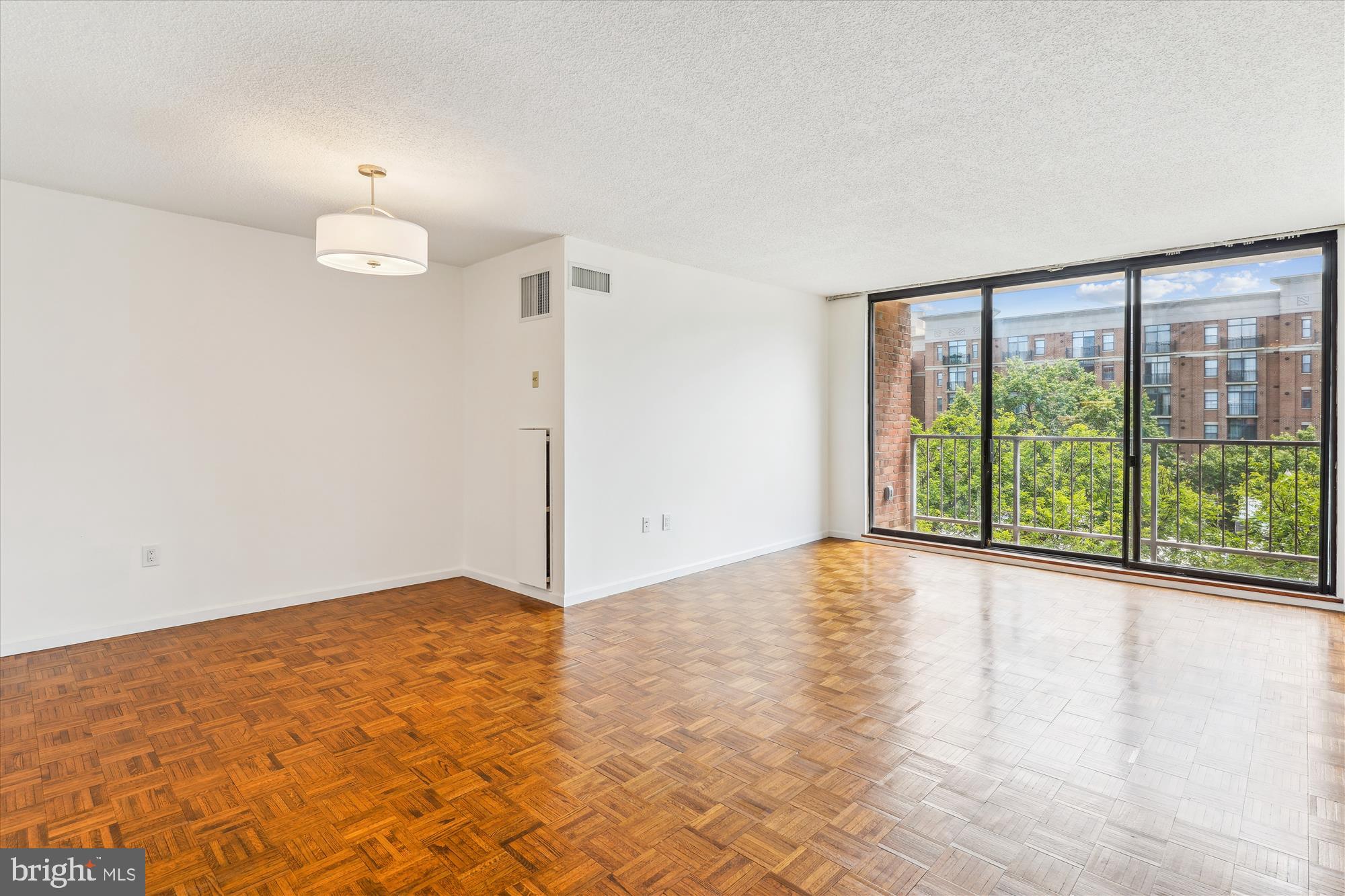 2555 Pennsylvania Avenue Northwest, Unit 816 Washington, DC 20037 - Photo 9 of 54 a view of an empty room with a window