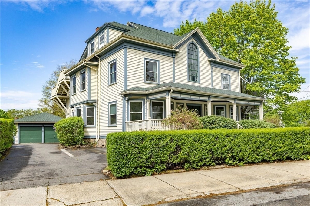 44 Baker Avenue, Unit 1 Beverly, MA 01915 - Photo 2 of 29 a front view of a house with a yard