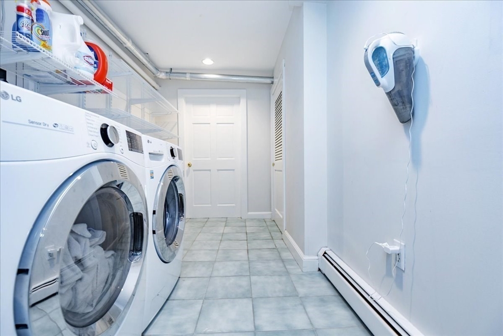 44 Baker Avenue, Unit 1 Beverly, MA 01915 - Photo 22 of 29 a utility room with dryer and washer