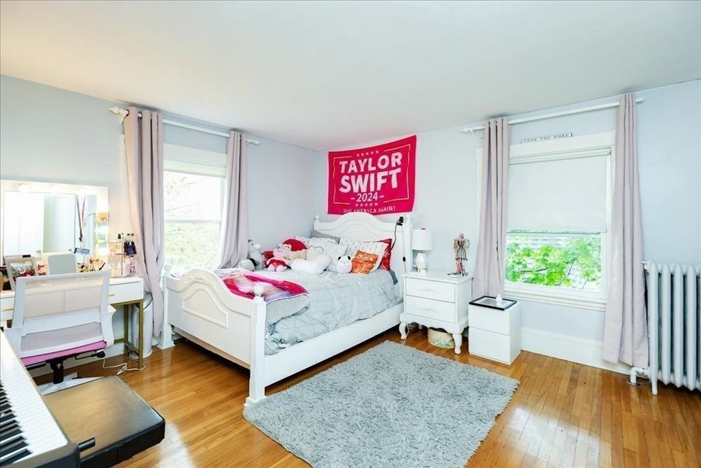 44 Baker Avenue, Unit 1 Beverly, MA 01915 - Photo 27 of 29 a bed room with a bed and a window