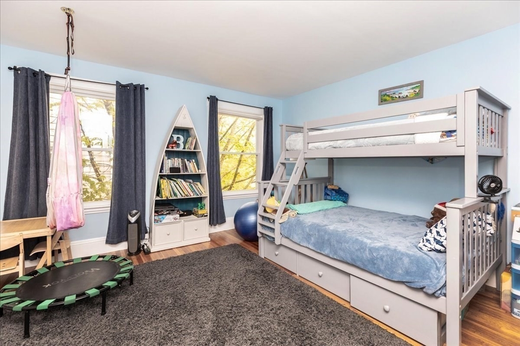 44 Baker Avenue, Unit 1 Beverly, MA 01915 - Photo 29 of 29 a bedroom with a bed and a window