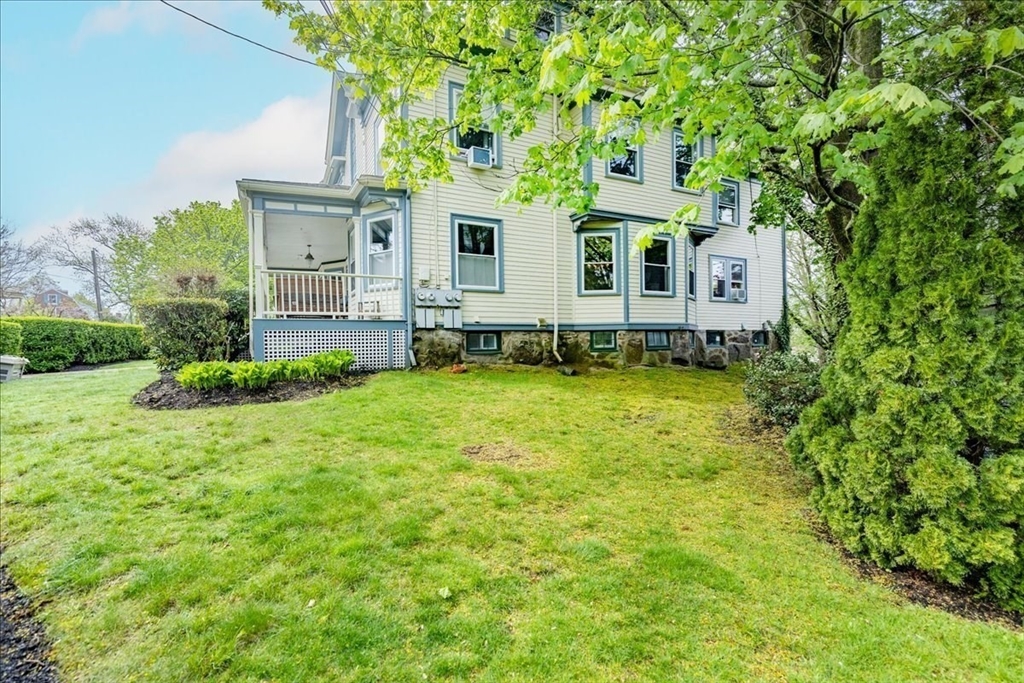 44 Baker Avenue, Unit 1 Beverly, MA 01915 - Photo 3 of 29 a house view with a garden space