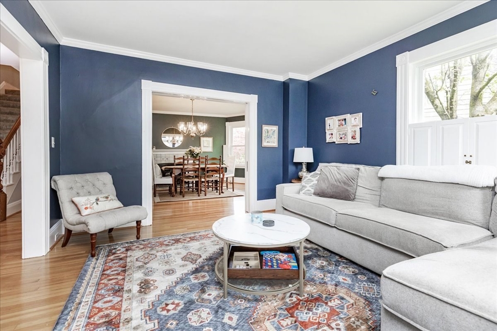 44 Baker Avenue, Unit 1 Beverly, MA 01915 - Photo 8 of 29 a living room with furniture and a wooden floor
