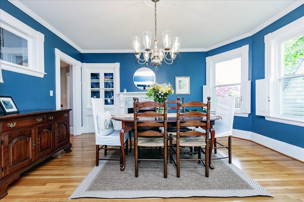 44 Baker Avenue, Unit 1 Beverly, MA 01915 - Photo 10 of 29 a view of a dining room with furniture a rug and wooden floor