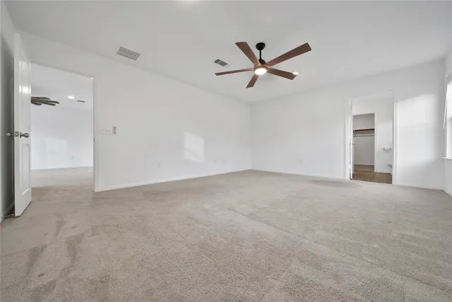 a view of a big room with carpet