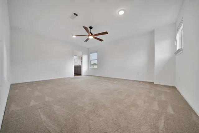 a view of a big room with carpet