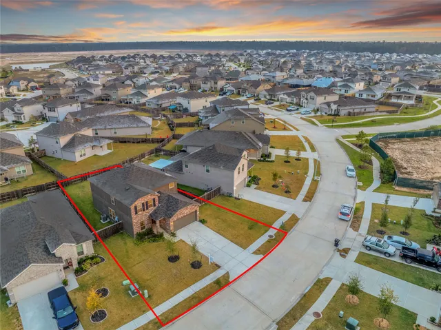 an aerial view of residential houses with outdoor space