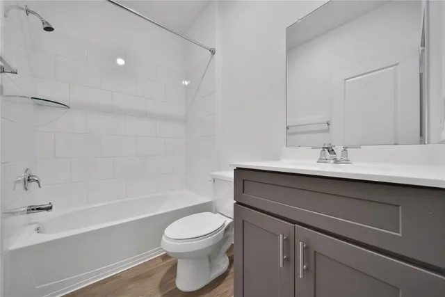 a bathroom with a sink a toilet and bathtub