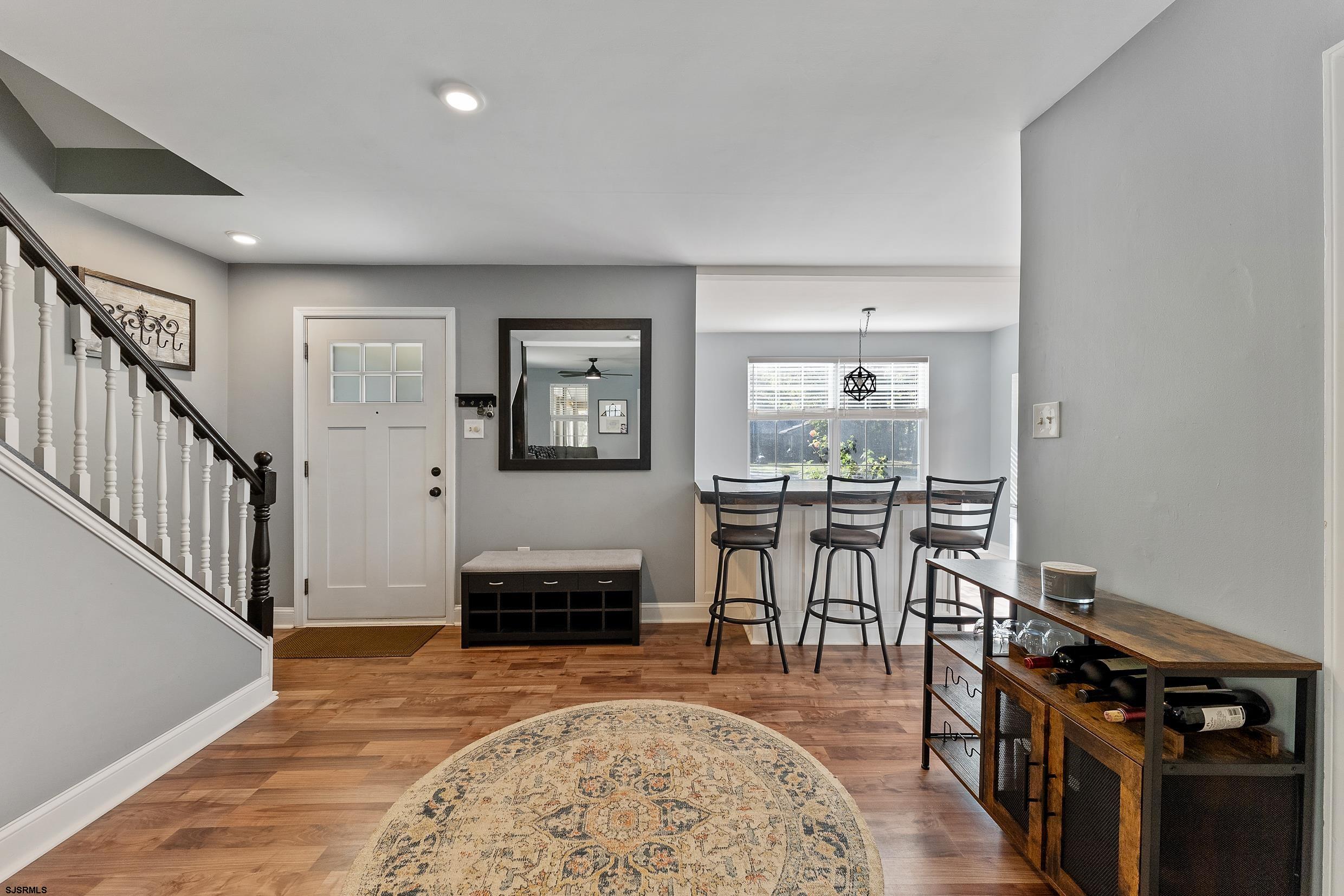 305 East Ridgewood Avenue Galloway Township, NJ 08205 - Photo 13 of 54 a view of a livingroom with furniture window and wooden floor