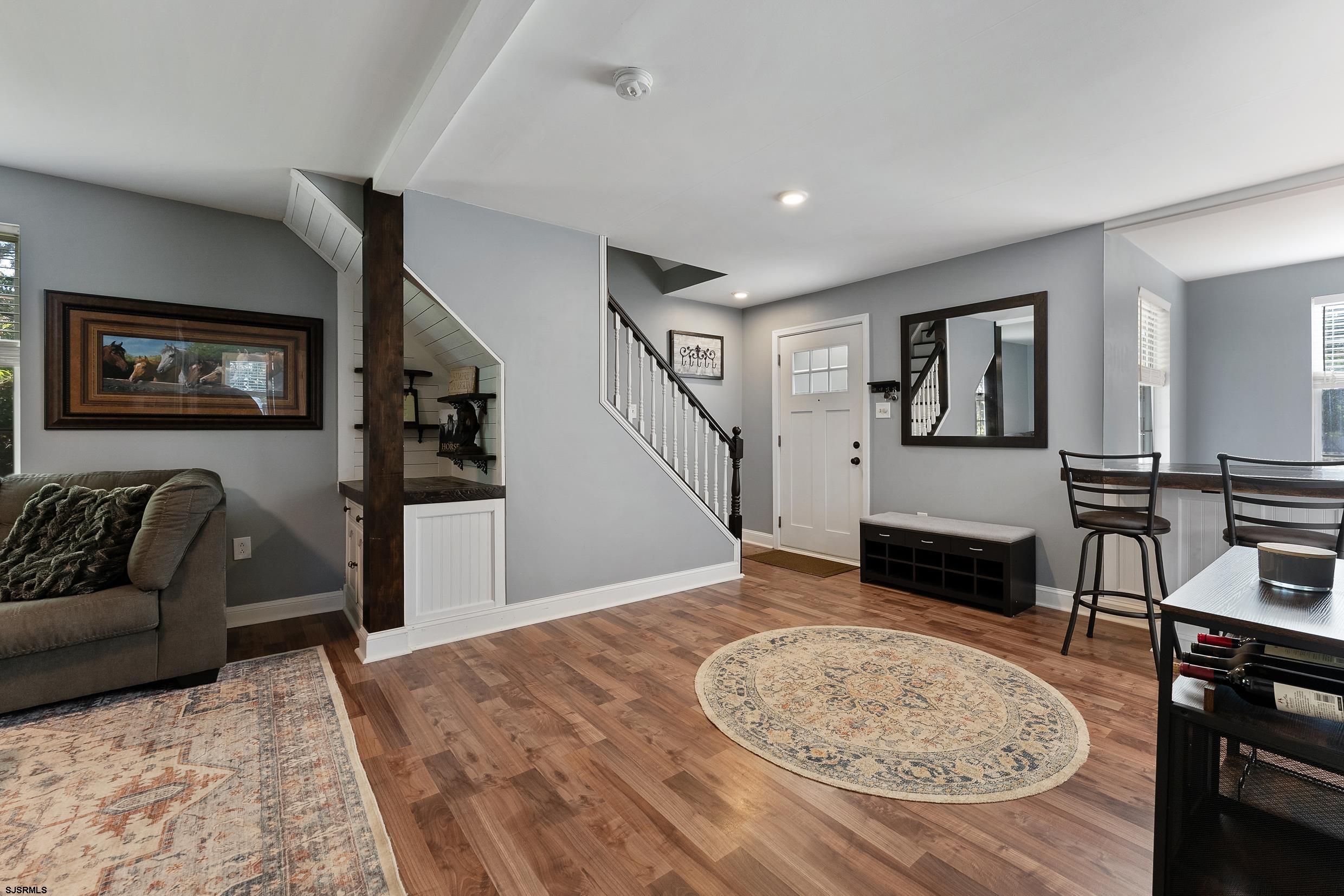 305 East Ridgewood Avenue Galloway Township, NJ 08205 - Photo 16 of 54 a view of a livingroom with furniture and staircase