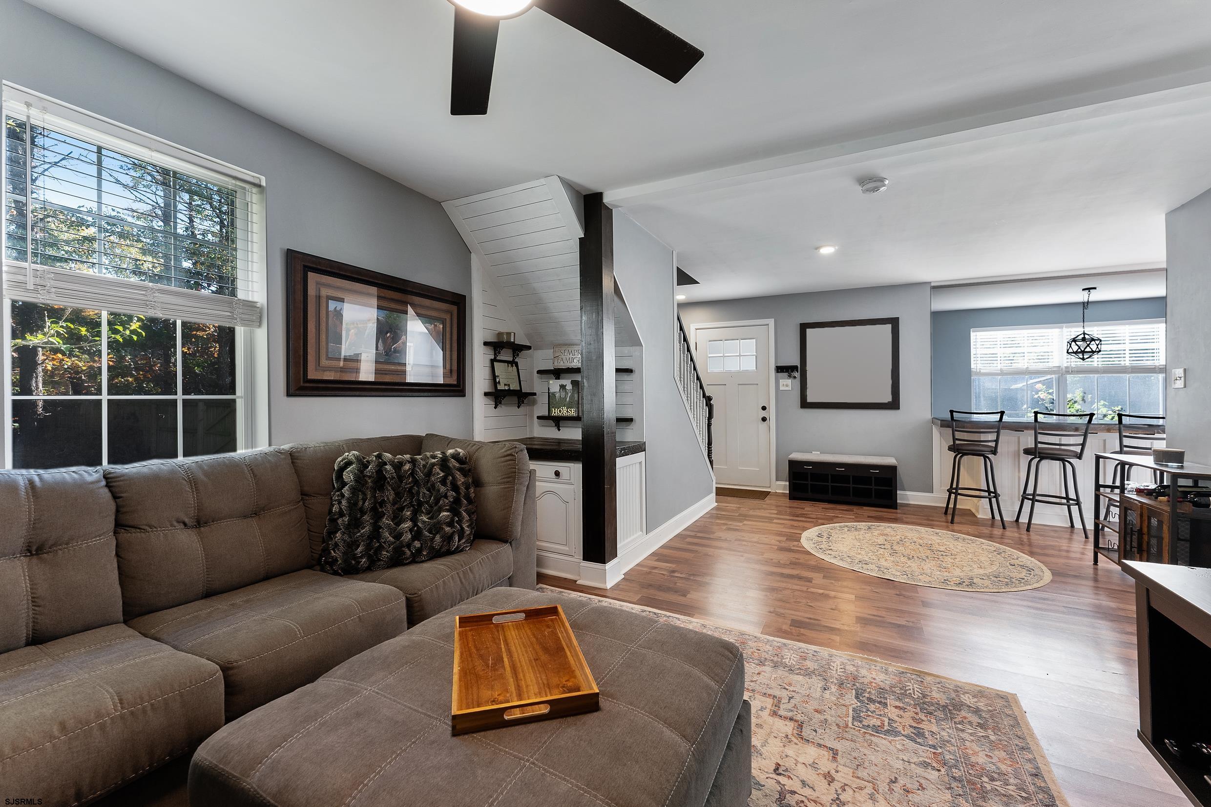 305 East Ridgewood Avenue Galloway Township, NJ 08205 - Photo 17 of 54 a living room with furniture and a flat screen tv