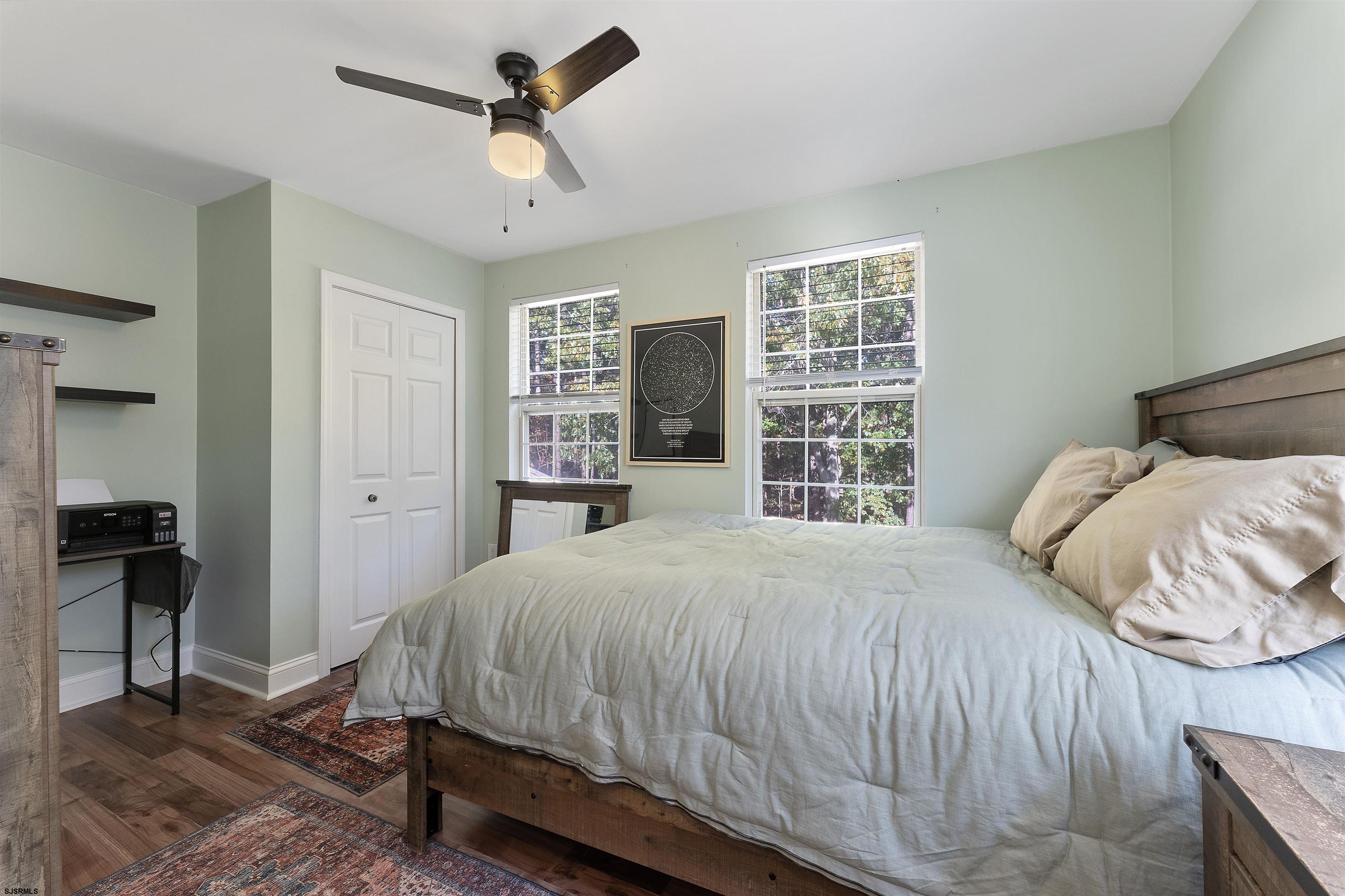 305 East Ridgewood Avenue Galloway Township, NJ 08205 - Photo 19 of 54 a bedroom with a bed and a window