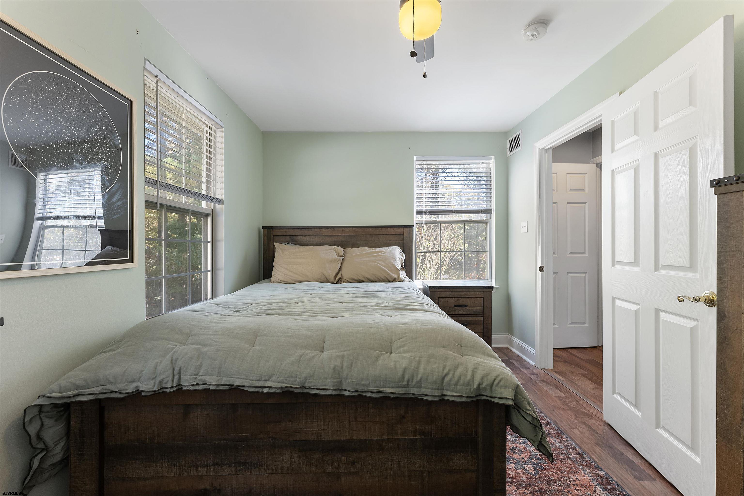 305 East Ridgewood Avenue Galloway Township, NJ 08205 - Photo 20 of 54 a bedroom with a bed and a window