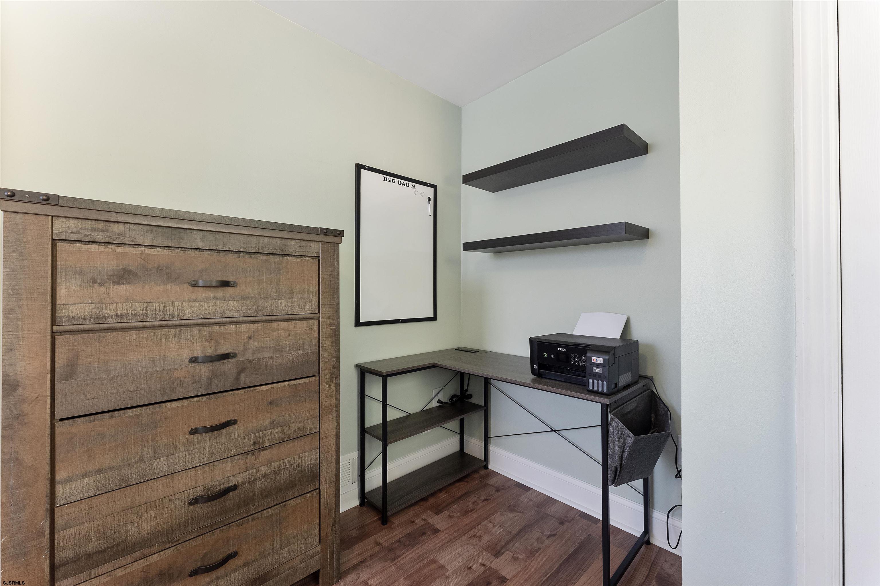 305 East Ridgewood Avenue Galloway Township, NJ 08205 - Photo 21 of 54 a view of walk in closet with clothes and shoes