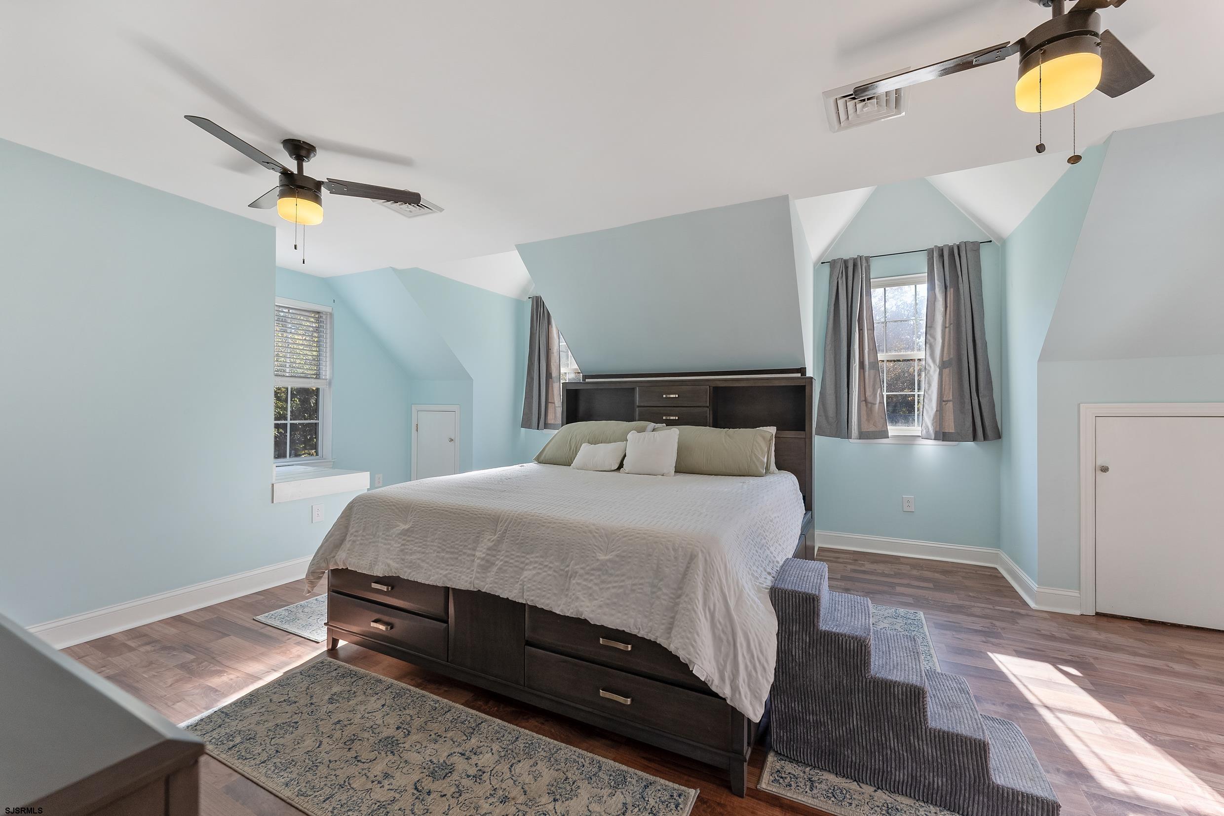 305 East Ridgewood Avenue Galloway Township, NJ 08205 - Photo 23 of 54 a bedroom with a bed mirror and window