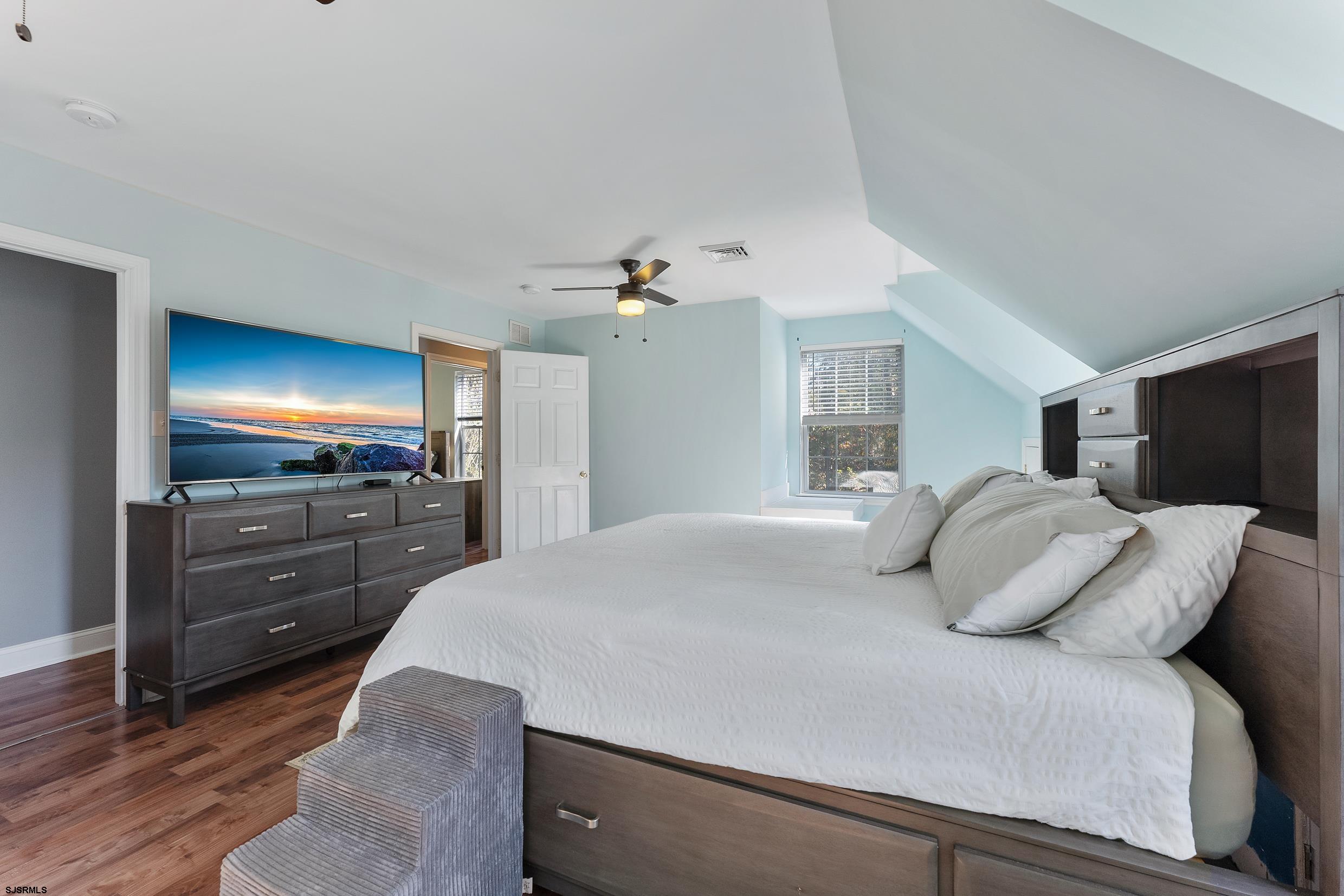 305 East Ridgewood Avenue Galloway Township, NJ 08205 - Photo 24 of 54 a bedroom with a bed and a flat screen tv