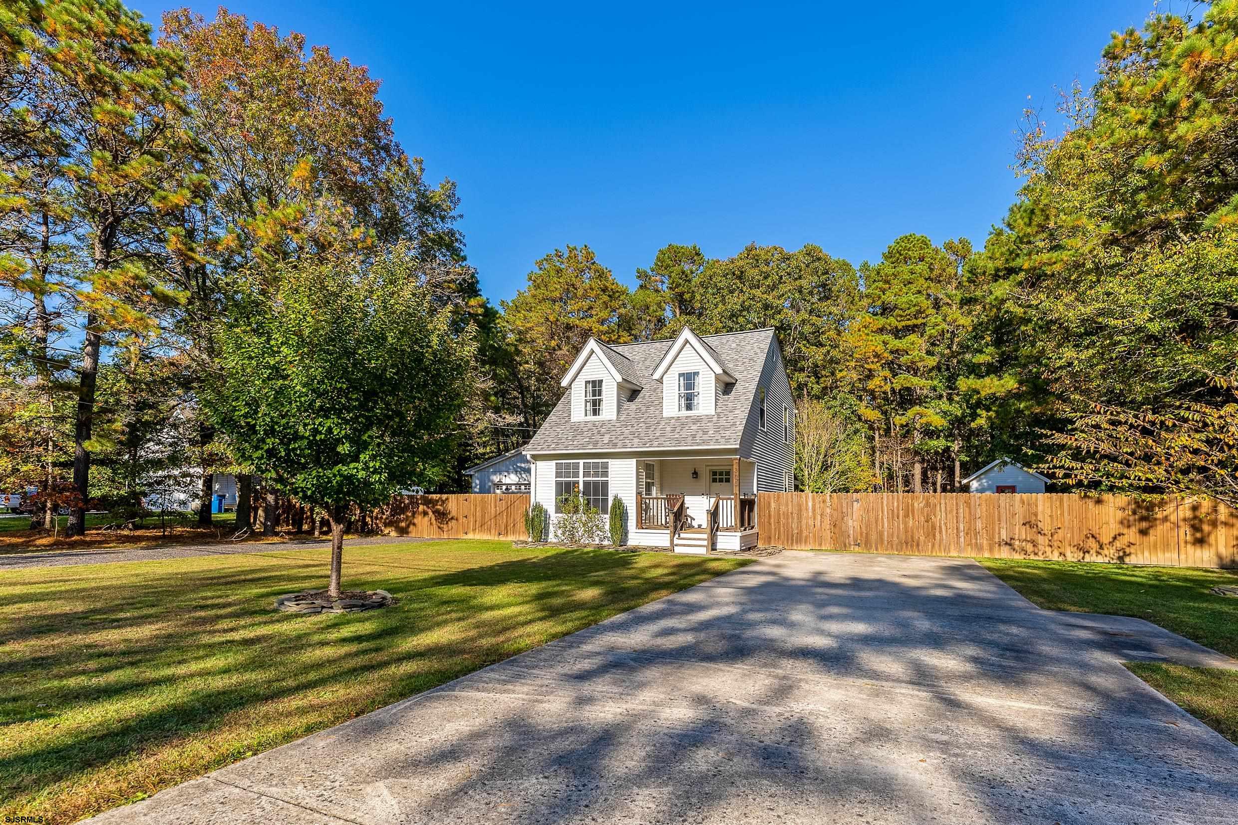 305 East Ridgewood Avenue Galloway Township, NJ 08205 - Photo 3 of 54 a front view of a house with a yard