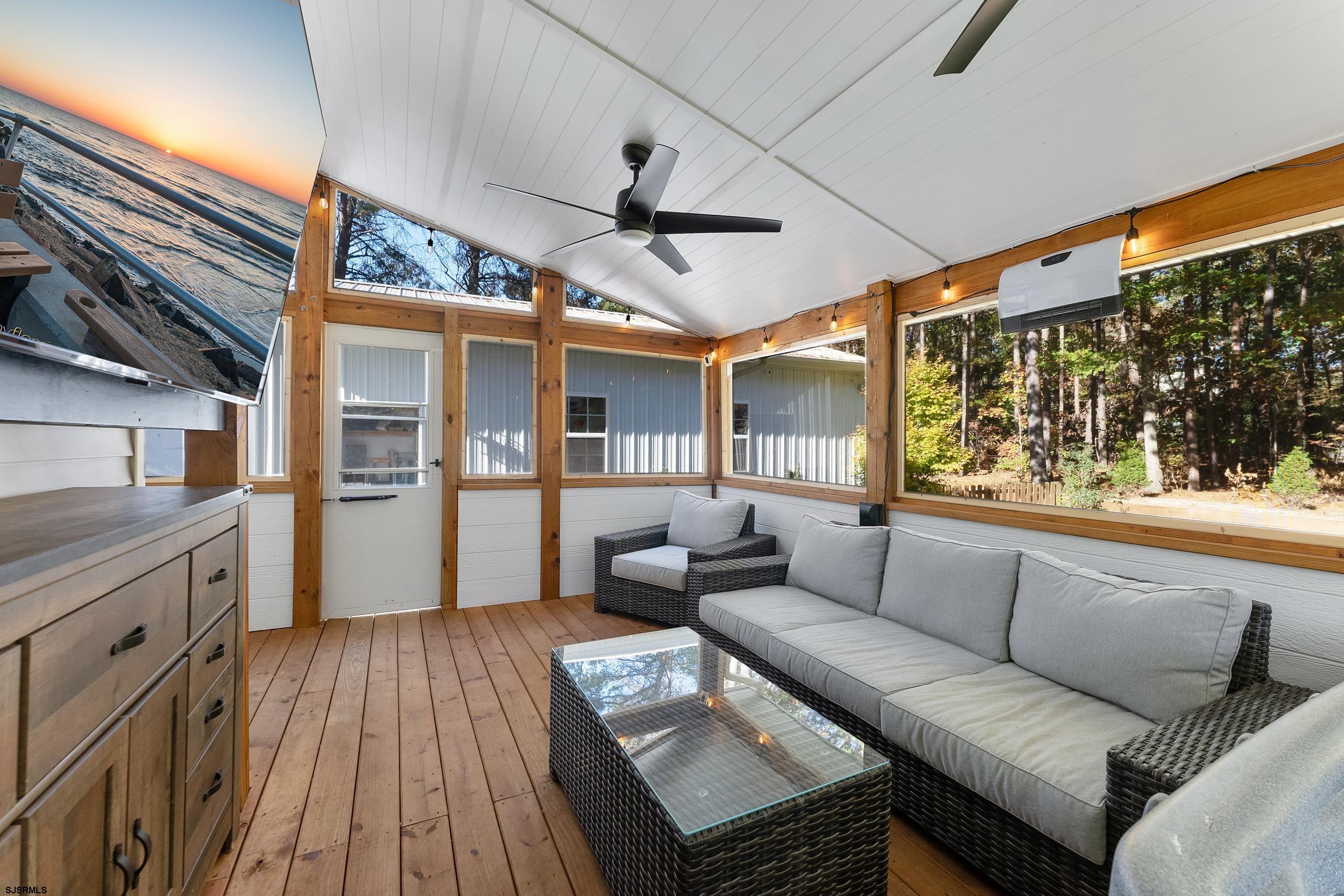 305 East Ridgewood Avenue Galloway Township, NJ 08205 - Photo 31 of 54 a living room with furniture and a large window