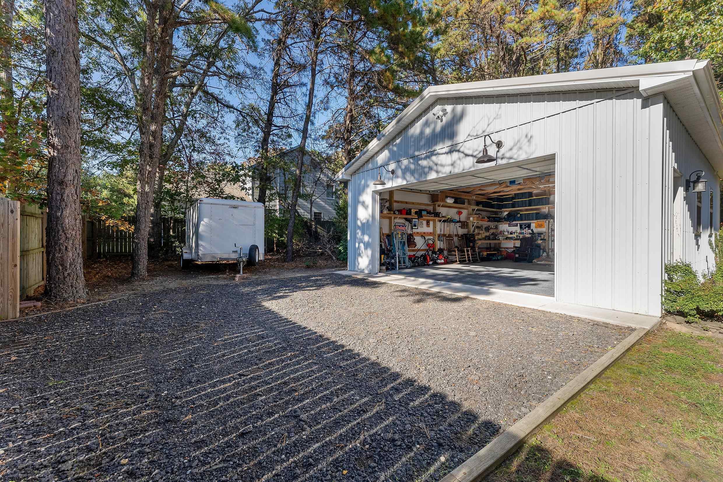 305 East Ridgewood Avenue Galloway Township, NJ 08205 - Photo 33 of 54 a view of a two chairs in the patio