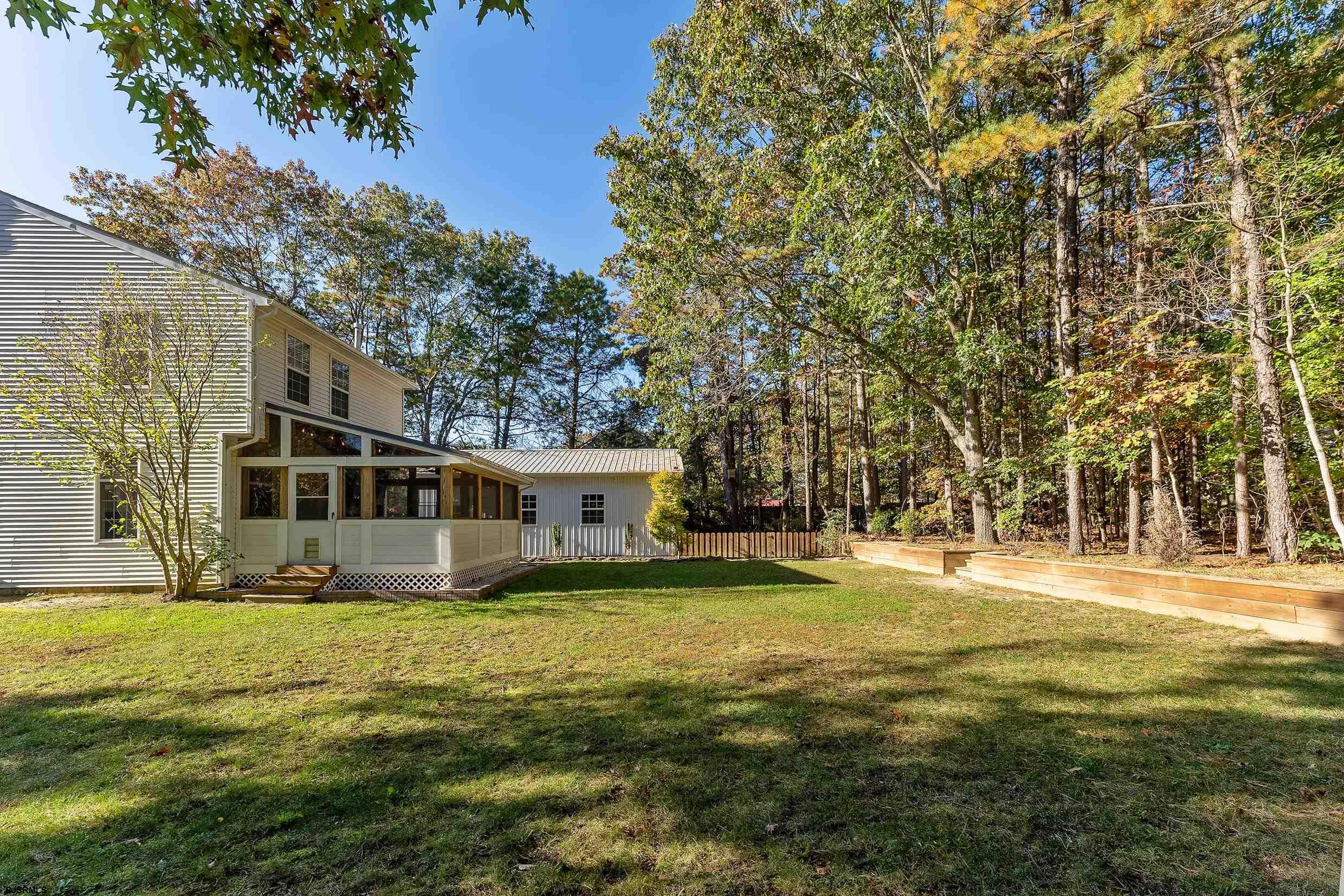 305 East Ridgewood Avenue Galloway Township, NJ 08205 - Photo 40 of 54 a view of a house with a big yard