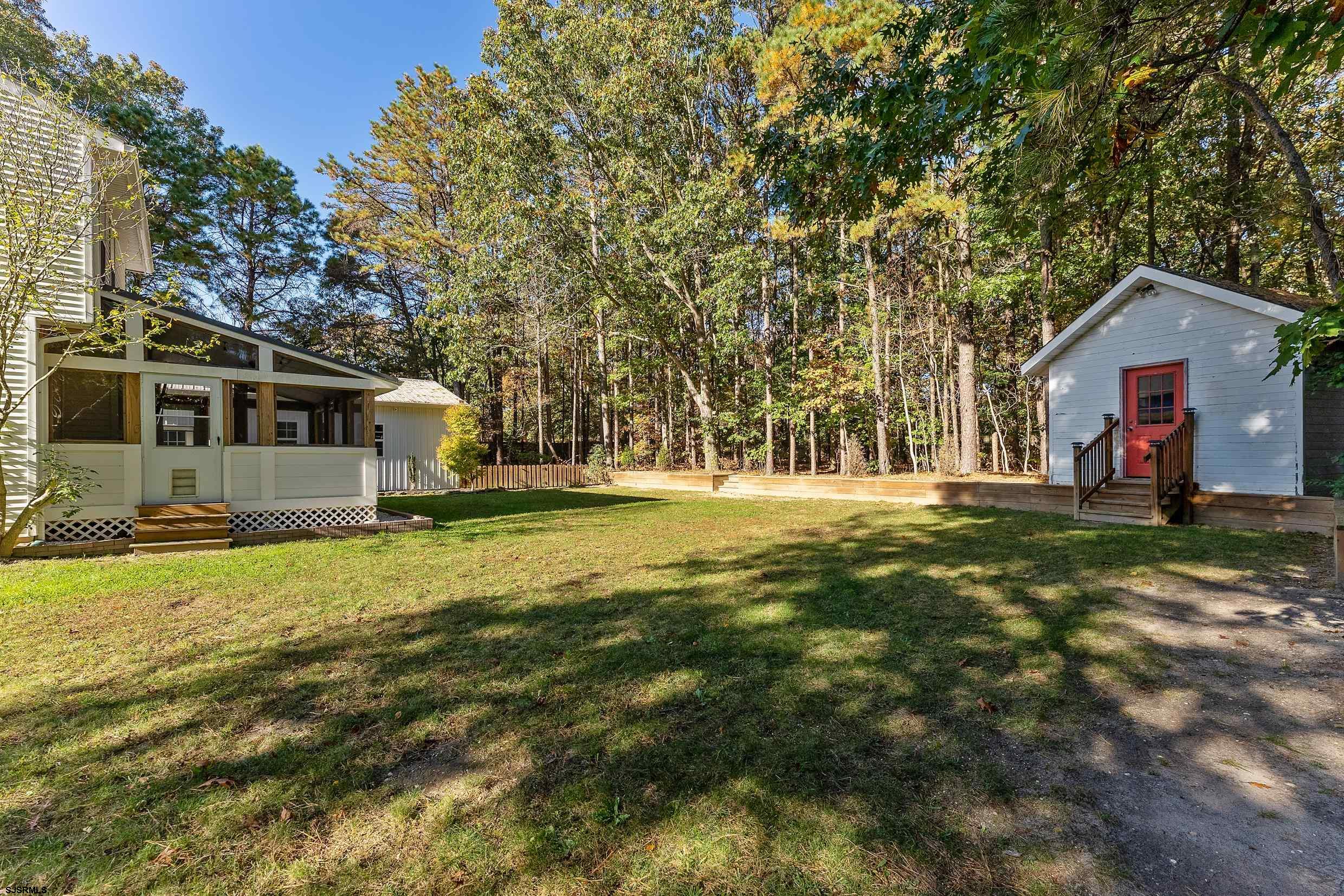 305 East Ridgewood Avenue Galloway Township, NJ 08205 - Photo 41 of 54 a front view of a house with a yard