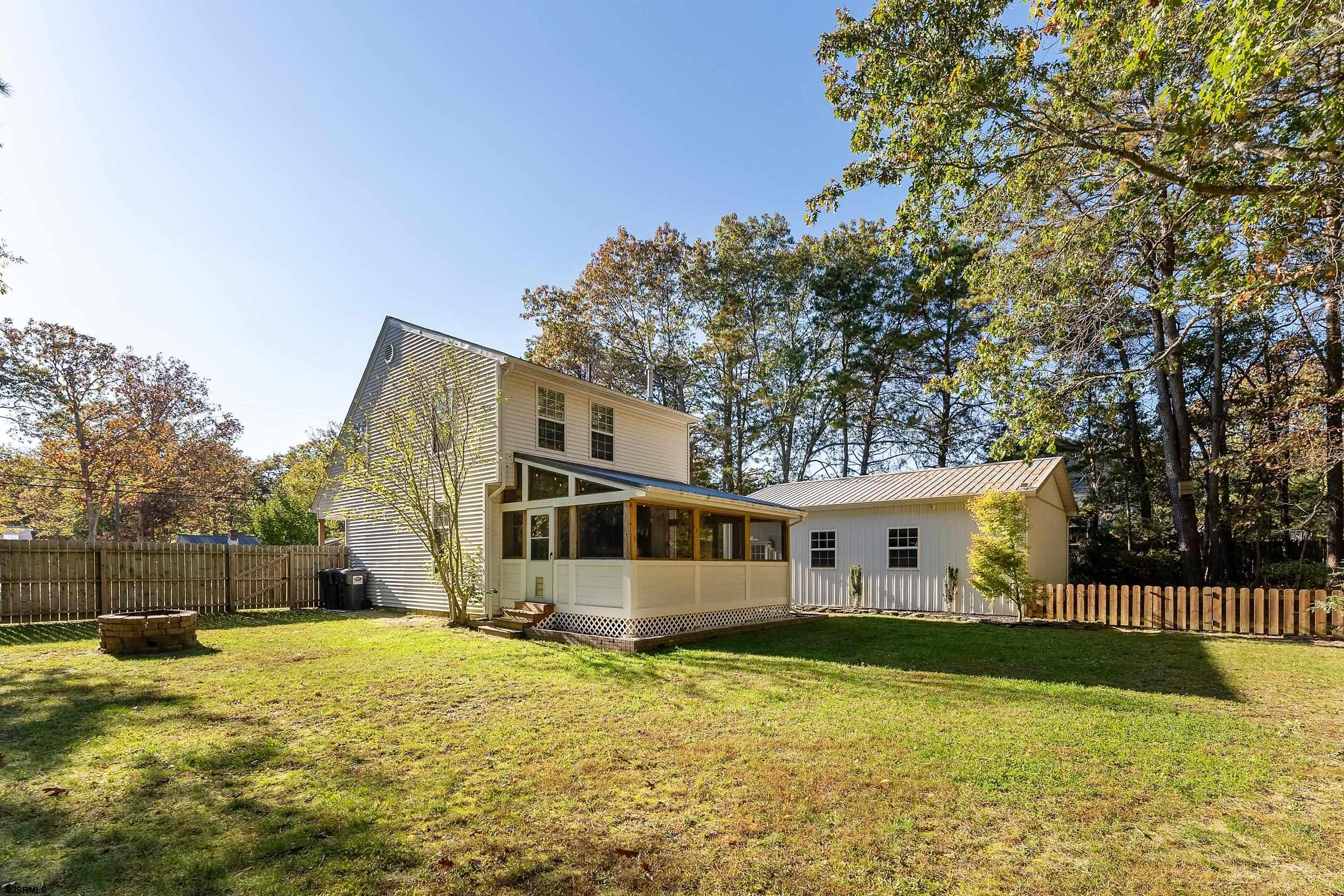 305 East Ridgewood Avenue Galloway Township, NJ 08205 - Photo 44 of 54 a view of a house with a backyard