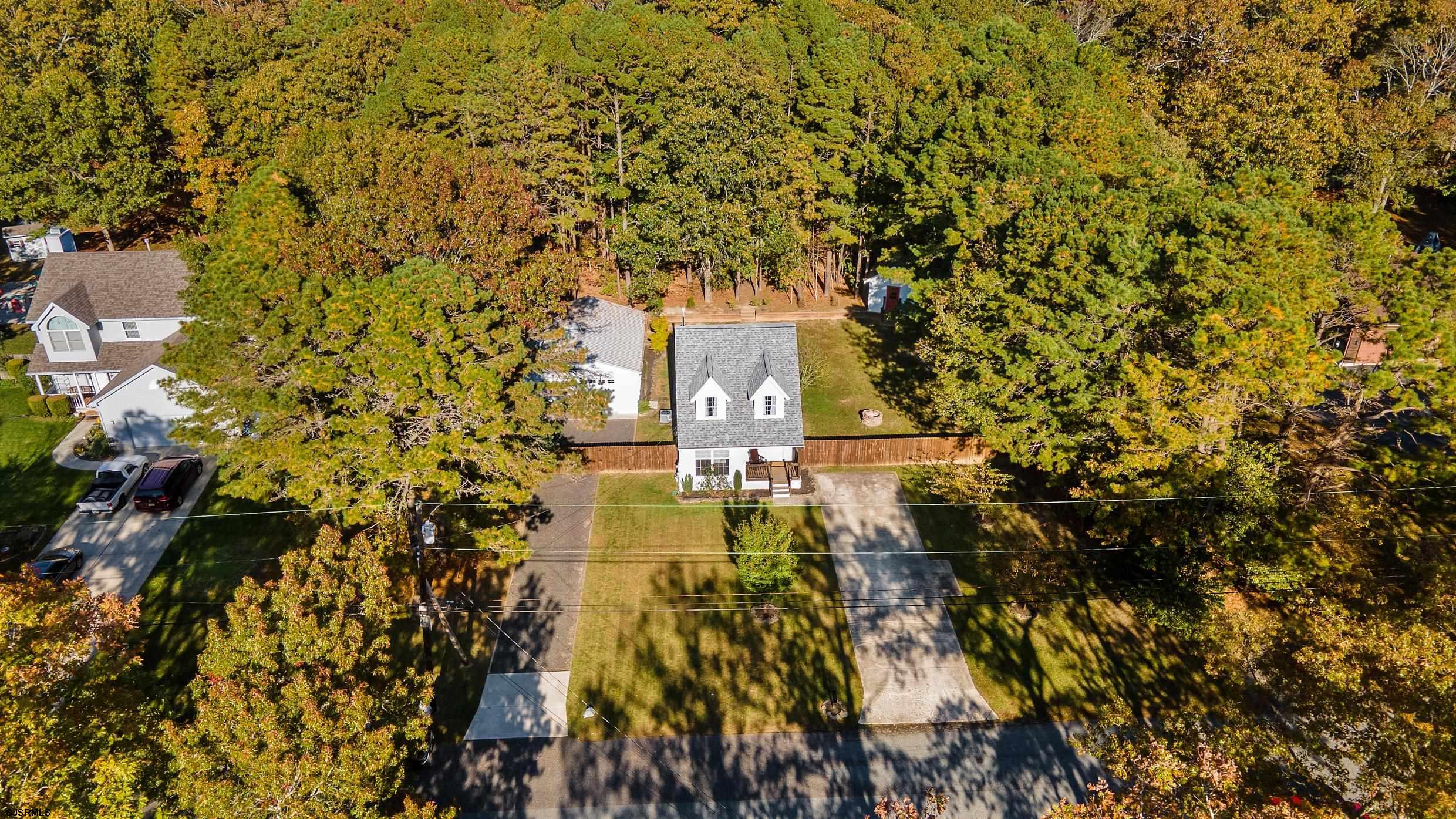 305 East Ridgewood Avenue Galloway Township, NJ 08205 - Photo 46 of 54 a view of a city with flower garden in front of it