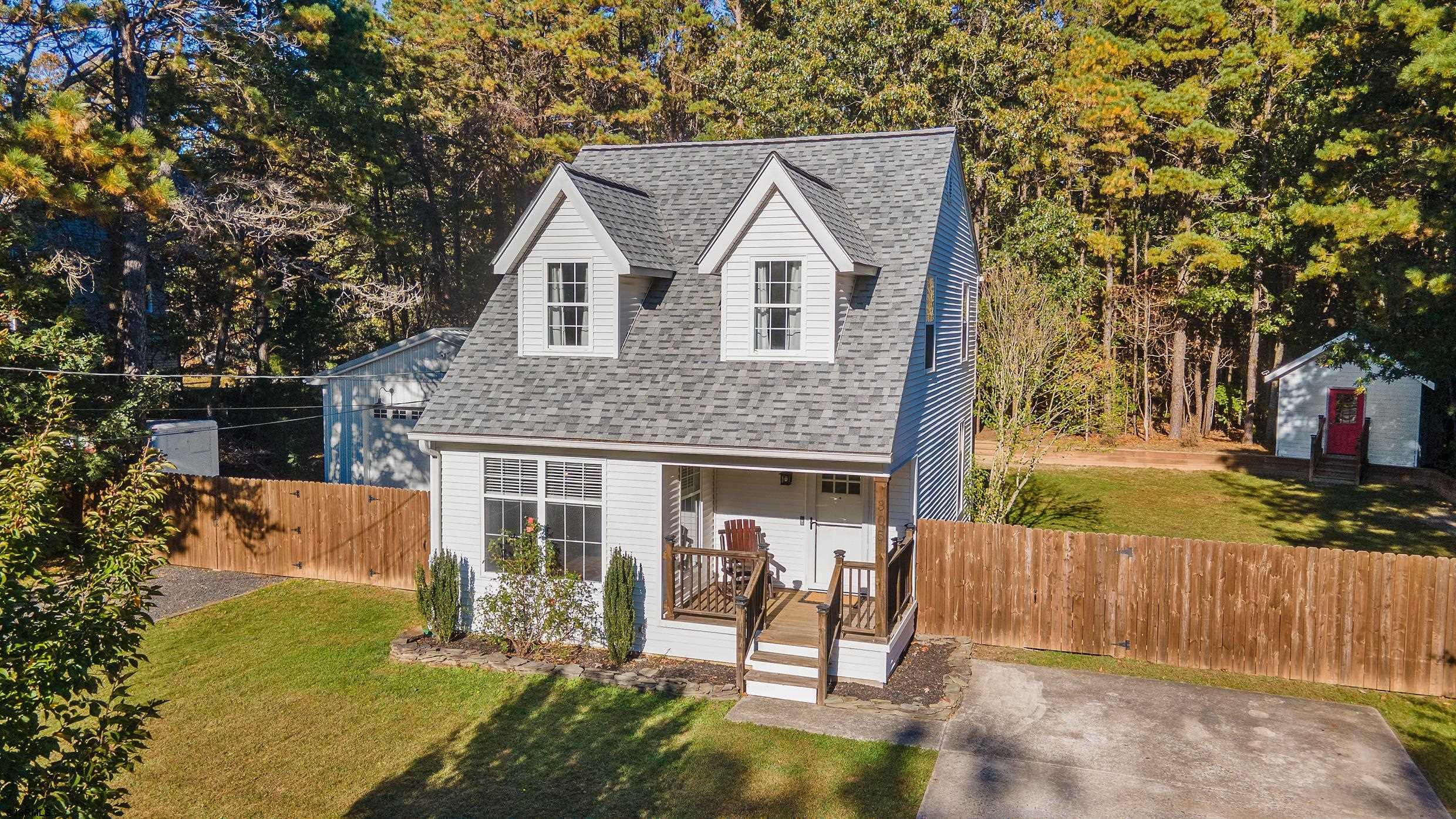 305 East Ridgewood Avenue Galloway Township, NJ 08205 - Photo 50 of 54 a view of a house with a yard chairs and iron fence