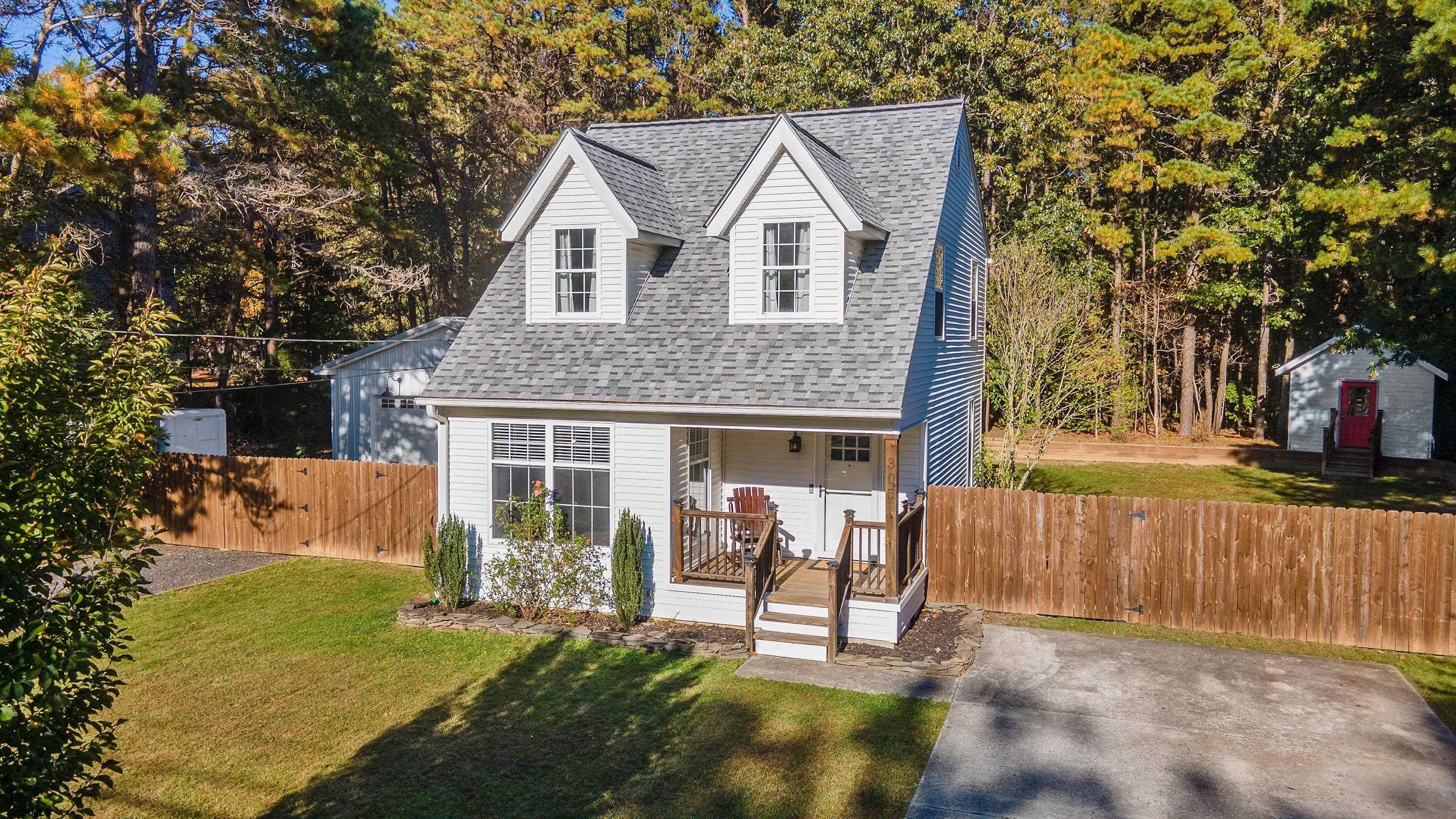 305 East Ridgewood Avenue Galloway Township, NJ 08205 - Photo 51 of 54 a view of a house with a yard and sitting area