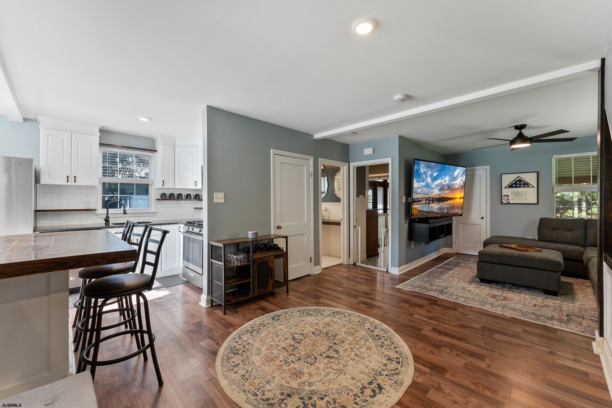 305 East Ridgewood Avenue Galloway Township, NJ 08205 - Photo 6 of 54 a living room with furniture and a wooden floor