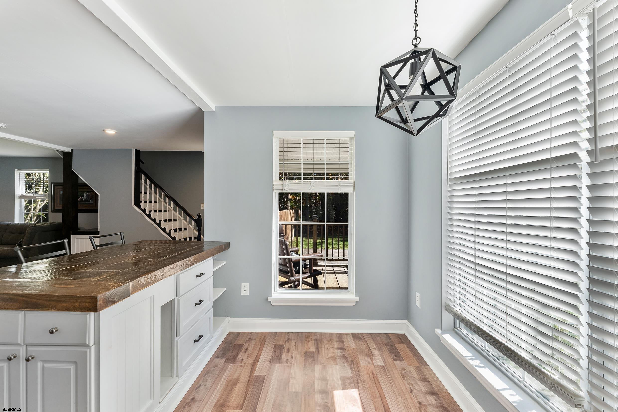 305 East Ridgewood Avenue Galloway Township, NJ 08205 - Photo 10 of 54 a view of a hallway with windows