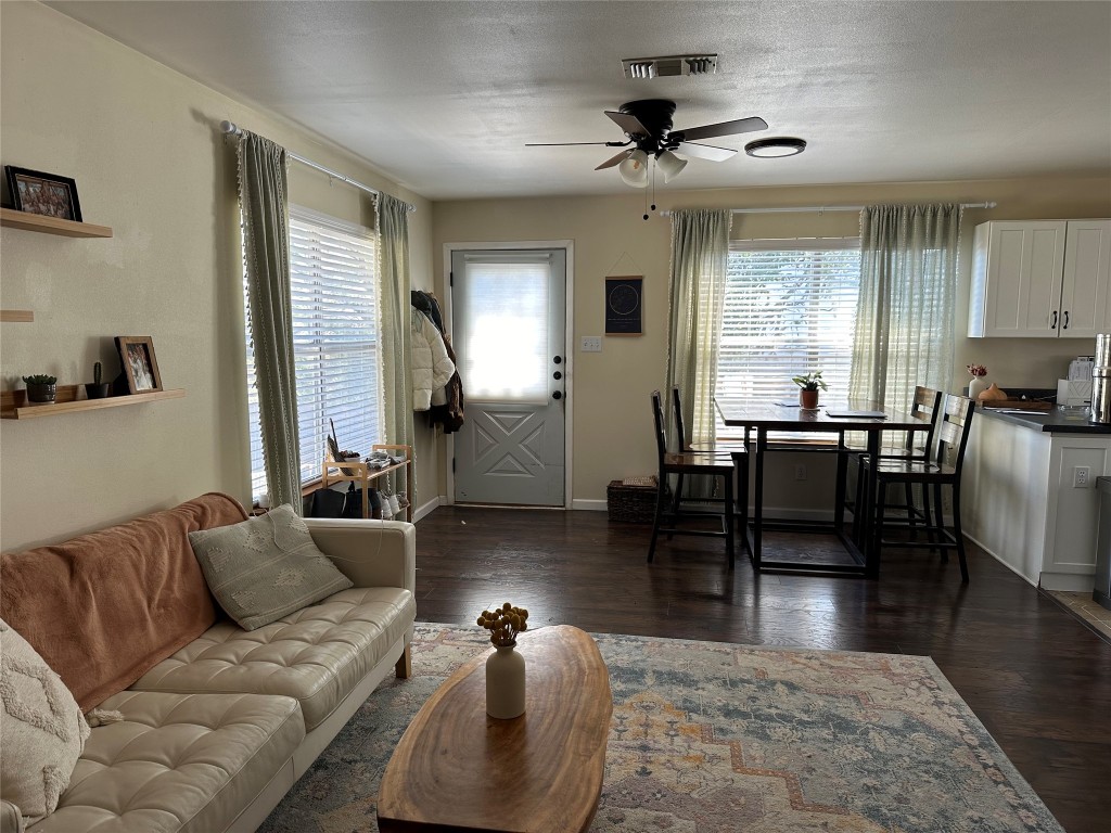 2105 Rabb Road, Unit UPPR Austin, TX 78704 - Photo 2 of 15 a living room with furniture a large window and wooden floor