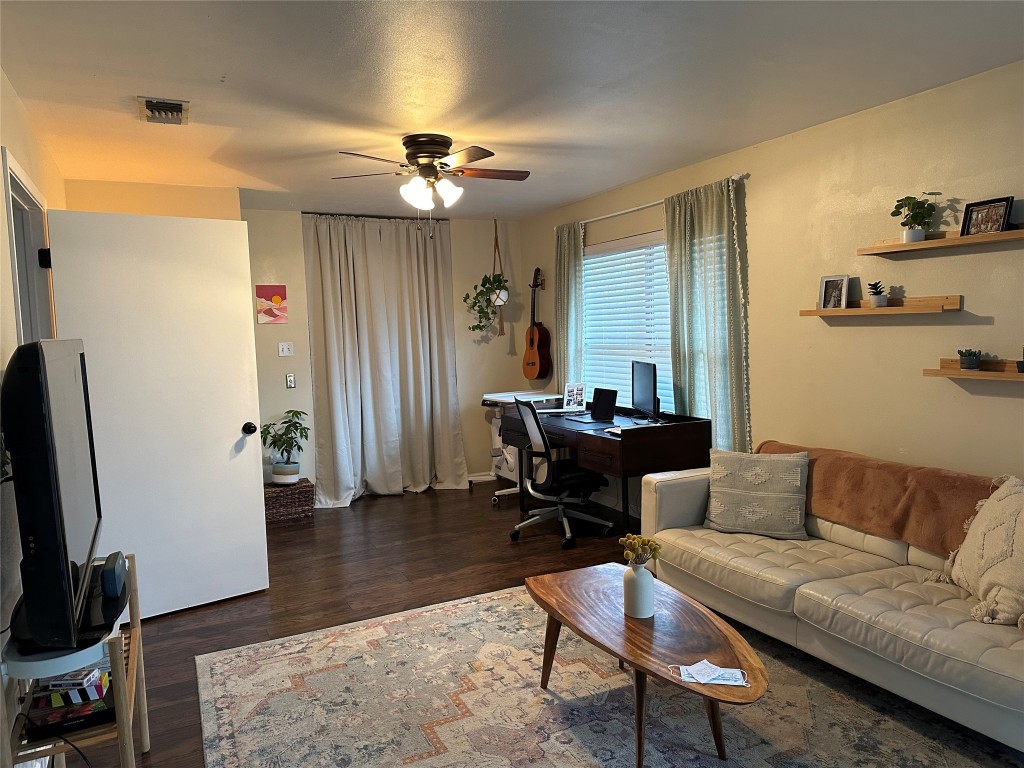 2105 Rabb Road, Unit UPPR Austin, TX 78704 - Photo 3 of 15 a living room with furniture a ceiling fan and a rug