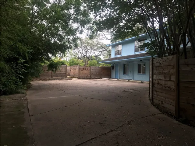 a view of a house with a tree
