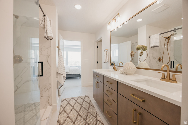 5902 Canyon Rim Road, Unit 620 Lehi, UT 84048 - Photo 47 of 78 Dual sink vanity with white countertop and brass-finish hardware