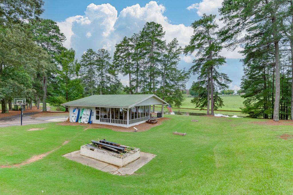 986 Austin Road Winder, GA 30680 - Photo 104 of 135 a view of a house with a big yard and a large tree