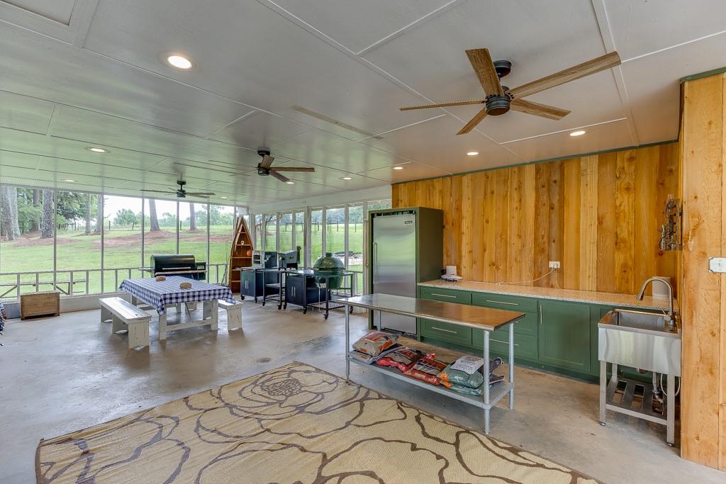 986 Austin Road Winder, GA 30680 - Photo 108 of 135 a living room with fireplace furniture and a large window