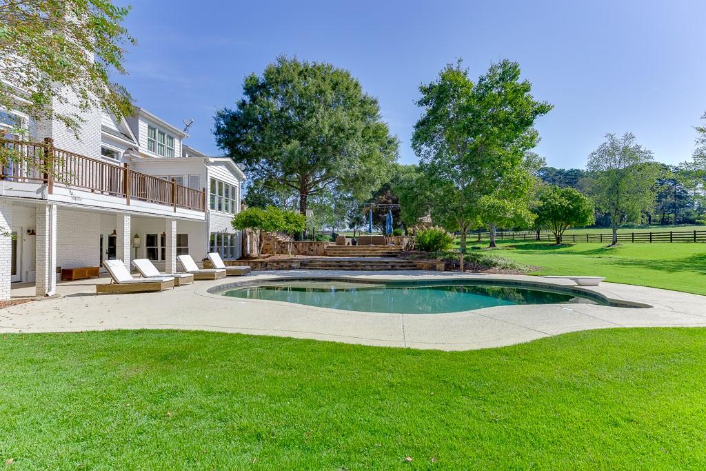 986 Austin Road Winder, GA 30680 - Photo 121 of 135 a view of a house with a yard porch and sitting area