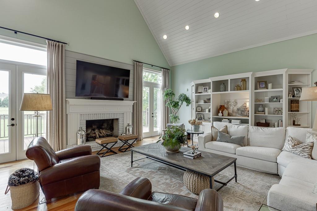 986 Austin Road Winder, GA 30680 - Photo 14 of 135 a living room with furniture fireplace and a flat screen tv