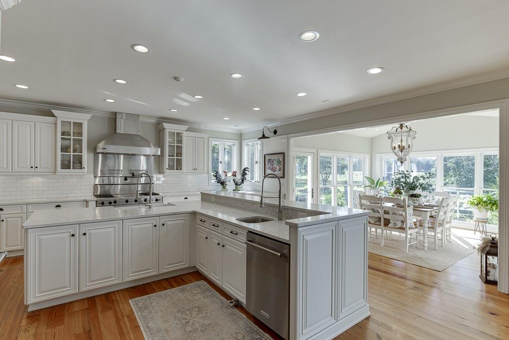986 Austin Road Winder, GA 30680 - Photo 27 of 135 a kitchen with lots of counter top space sink and dining table