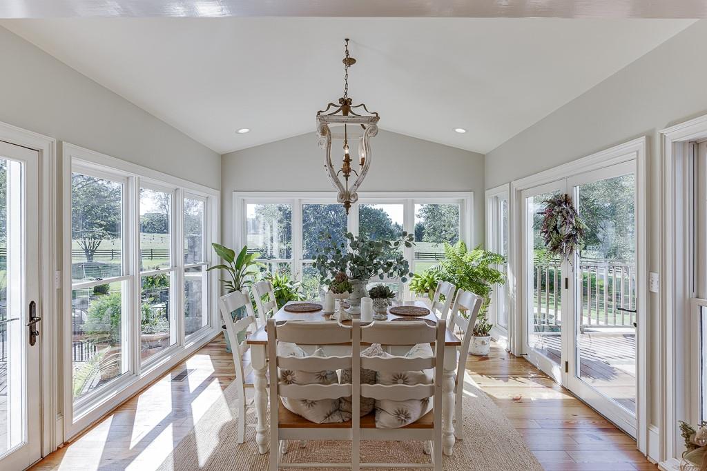986 Austin Road Winder, GA 30680 - Photo 28 of 135 a view of a dining room with furniture window and wooden floor