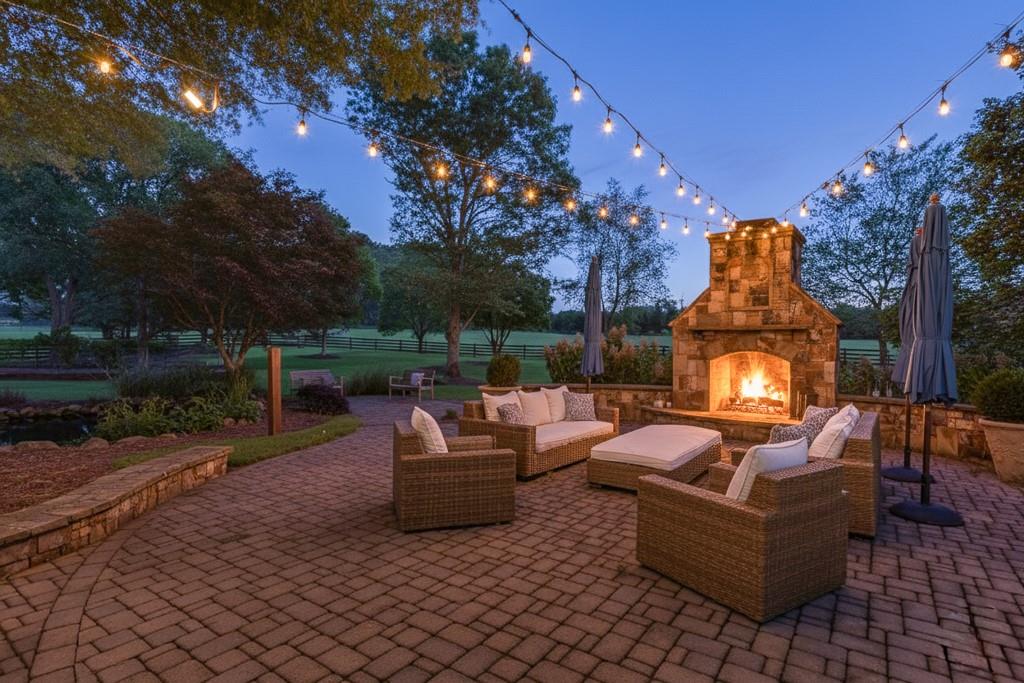 986 Austin Road Winder, GA 30680 - Photo 33 of 135 a view of a patio with couches and a fire pit and a fire pit
