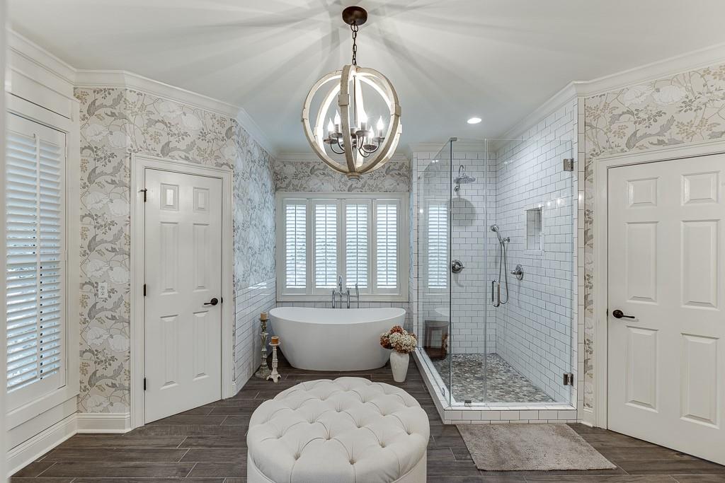 986 Austin Road Winder, GA 30680 - Photo 45 of 135 a bathroom with a granite countertop toilet a sink and shower