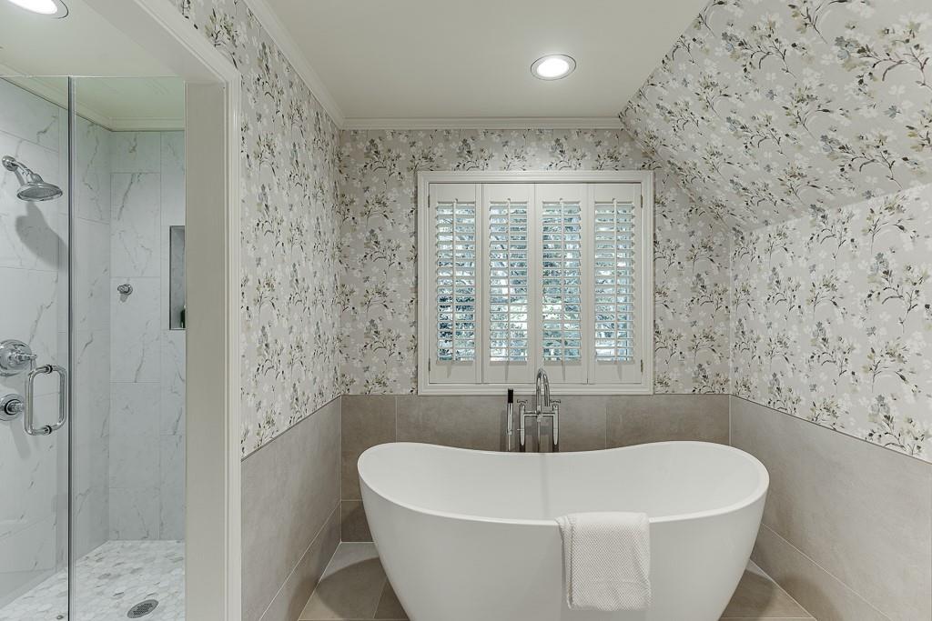 986 Austin Road Winder, GA 30680 - Photo 58 of 135 a white bath tub sitting in a bathroom next to a window