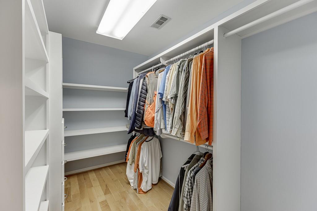 986 Austin Road Winder, GA 30680 - Photo 60 of 135 a view of walk in closet with clothes and shoes